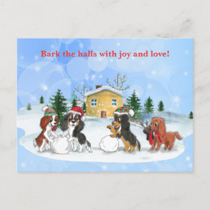 Cavalier King Charles Spaniels bauen einen Schneem Feiertagspostkarte