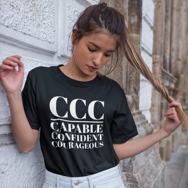 CCC - fähig, zuversichtlich, mutig T-Shirt (Young woman wears a "CCC:Capable, Confident, Courageous" black t-shirt.)