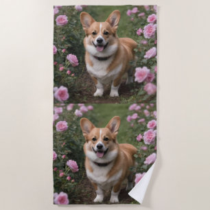 "Charmanter Begleiter: Ein Corgi in einem rosa Ros Strandtuch