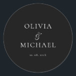 Chic Script Black Minimalist Wedding Runder Aufkleber<br><div class="desc">Add a personal and elegant touch to your wedding favors, envelopes, or packaging with this minimalist round sticker featuring your custom name in a graceful script font. Designed to complement a modern and timeless wedding theme, this classic black-and-white design pairs beautifully with any part of your celebration. Perfect for sealing...</div>