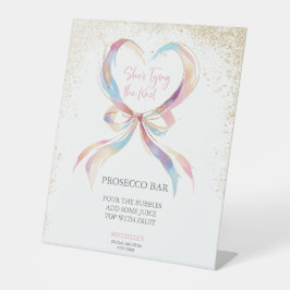 Chic Sie bindet die knallrosa Bow Prosecco-Bar Sockelschild