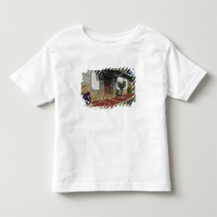 CHINA, Provinz Yunnan, Tianshengying. Trocknen Kleinkind T-shirt