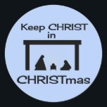 CHRIST in CHRISTmas Stickers behalten (2 Größen)<br><div class="desc">Sehr einfache Krippe,  blauer Hintergrund,  Silhouetten. Baby Jesus wird mit leichten gelben Lichtstrahlen betont. Behalt CHRIST in CHRISTmas.</div>