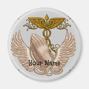 Christliche Hände pflegen Magnet