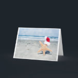 Christmas At The Beach Feiertagskarte<br><div class="desc">Starfish wearing a santa hat in sunny Southern California</div>