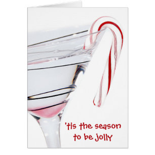 Christmas cocktail with candy cane on white