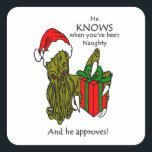 Christmas Cthulhu Square Sticker<br><div class="desc">Weihnachten Cthulhu mit Weihnachtsmannmütze und hell verpackt Weihnachten Geschenk. Er weiß,  wann du unartig warst,  und er stimmt zu!</div>
