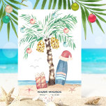 Christmas Island Surf Santa Tropical Beach Feiertagskarte<br><div class="desc">Beach theme Christmas card features a palm tree Christmas tree (decorated with ornaments and lights) on a tropical island with a Santa hat perched on a surfboard, a present, starfish, ocean waves, sea birds and a "Warm Wishes" holiday greeting. The greeting and name can be personalized. Art by KL Stock...</div>