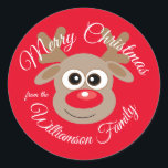 Christmas Niedlich Reindeer Cartoon Red Runder Aufkleber<br><div class="desc">Mit diesem niedlichen Cartoon-Charakter-Rentier, der jedem ein fröhliches Weihnachtsaufkleber wünscht, macht er sich ein wenig Freude. Text kann geändert werden. Cartoon Rentiercharakter mit roter, glänzender Nase auf urlaubserregendem rotem Hintergrund. Wenn Sie Hilfe benötigen, um es besser an Ihre Wünsche anzupassen, schicken Sie mir eine E-Mail und ich helfe Ihnen gerne....</div>
