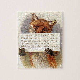 Circa 1900: Ein Fuchs hält ein Weihnachtsversum Puzzle