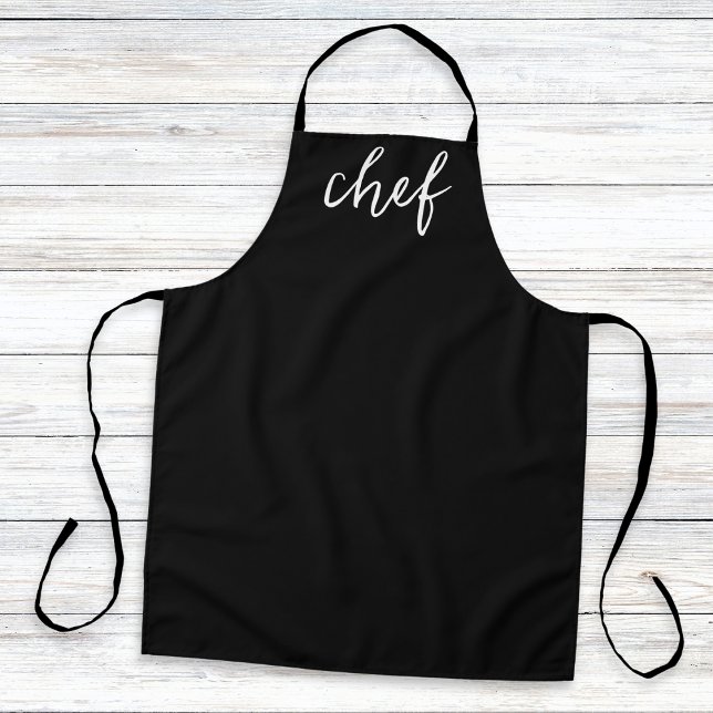 Classic Black Minimal Simple Stylish Kitchen Koch Schürze (A stylish, minimalist, black kitchen apron with the word 'chef' in white script typography)