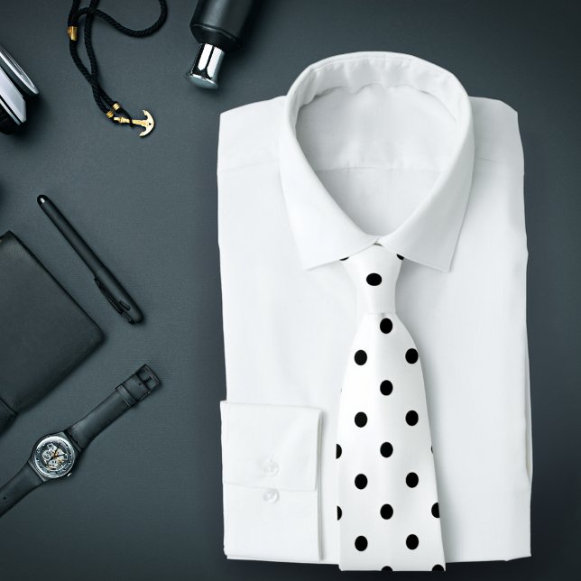 Classic Black Polka Dot Pattern on White Tie Krawatte (A white tie with black polka dots is featured on an assemblage of men's accessories.)