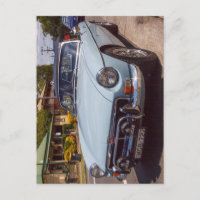 Classic blue MGB roadster sports car.