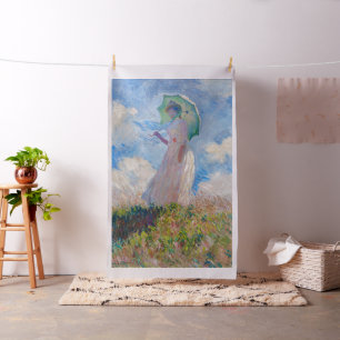 Claude Monet - Eine Frau mit einem Parasol gegenüb Stoff