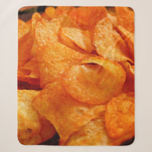 Close up of juicy, crispy, chips on black plate. sherpadecke