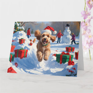 Cockapoo läuft im Schnee mit Weihnachtsmütze Karte