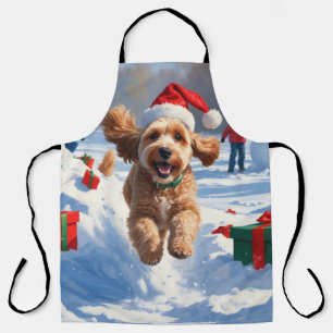 Cockapoo läuft im Schnee mit Weihnachtsmütze Schürze