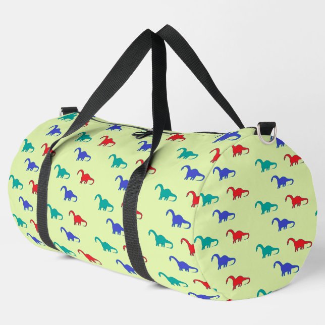 Colorful dinosaurs pattern on green duffle bag (Linke Ecke)