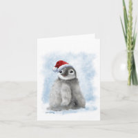 Comic-Pinguinküken mit Weihnachtsmannmütze