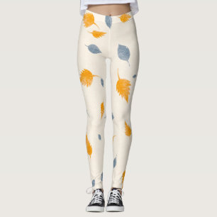 Coole, blaue und goldgelbe Blätter auf Creme Leggings