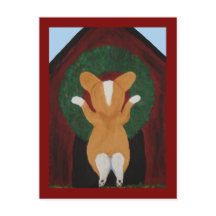 Corgi bringt Weihnachtskranz am Hundehaus an