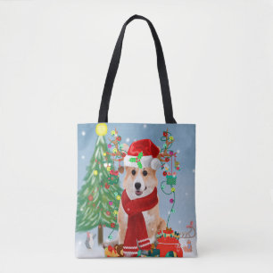 Corgi Hund in Schnee mit Weihnachtsgeschenken