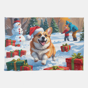 Corgi läuft im Schnee mit Weihnachtsmütze Geschirrtuch