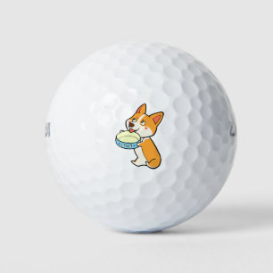 Corgi mit Teller Golfball