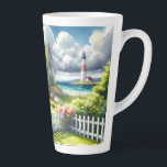 Cottage With View Of The Lighthouse Milchtasse<br><div class="desc">A dreamy coastal cottagecore landscape filled with soft watercolor charm and breezy seaside tranquility. A welcoming seaside cottage sits among lush garden paths, blooming flowers, and a bright white picket fence, creating a warm storybook atmosphere. In the distance, a tall lighthouse rises beside sparkling blue ocean waves, adding a classic...</div>