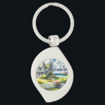 Cottage With View Of The Lighthouse Schlüsselanhänger<br><div class="desc">A dreamy coastal cottagecore landscape filled with soft watercolor charm and breezy seaside tranquility. A welcoming seaside cottage sits among lush garden paths, blooming flowers, and a bright white picket fence, creating a warm storybook atmosphere. In the distance, a tall lighthouse rises beside sparkling blue ocean waves, adding a classic...</div>