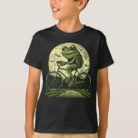 Cottagecore Frog Riding Bicycle T-Shirt<br><div class="desc">Cottagecore Frog Riding Bicycle T-Shirt
Show your love for bike riding frogs in cottagecore style with this fun frog bike rider Cottagecore Frog Riding Bicycle . Suitable to any any cottagecore outfit for women,  men and kids.</div>