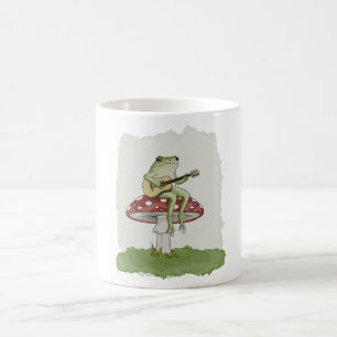 Cottagecore-Frosch spielt Gitarre auf Pilz-Kunst Kaffeetasse