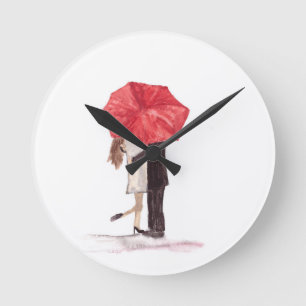Couple in love under red umbrella runde wanduhr