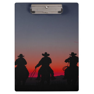 Cowboy bei Sonnenuntergang Klemmbrett