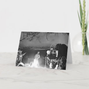 Cowboys spielen und singen um ein Lagerfeuer Karte