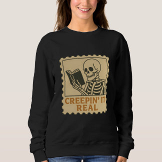 Creepin" It Real - Skelettbuch zu Halloween Sweatshirt