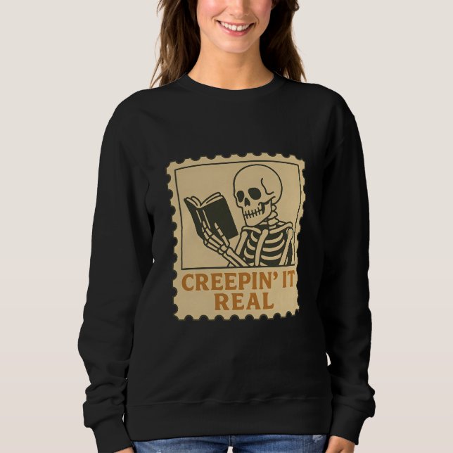 Creepin" It Real - Skelettbuch zu Halloween Sweatshirt (Vorderseite)