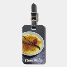 Creme brulae auf Tonschiefer mit Himbeere und Vani Gepäckanhänger
