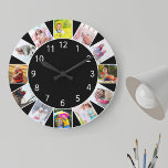 Custom 12 Foto Collage Gray Black Round Große Wanduhr<br><div class="desc">Personalisierte Foto Uhr mit eigenen Fotos. Die Fotovorlage ist für Sie bereit, 12 Ihrer Lieblingsbilder im Uhrzeigersinn von oben hinzuzufügen. Das schlichte und frische schwarze Design mit weißen Zahlen wird mit modernem und modernem Dekor großartig aussehen. Für dieses Design werden die Foto mit Quadrat-Inagram besonders einfach zu bedienen sein. Bitte...</div>