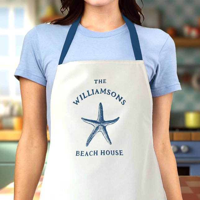 Custom Blue Coastal Starfish Beach House Schürze (Woman in a kitchen wearing a white apron with a blue starfish design and The Williamsons Beach House)