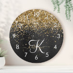 Custom Gold Glitzer Black Sparkgram Monogram Uhr<br><div class="desc">Dieses trendige und elegante Round-Clock-Design mit hübschem vergoldeten Glitzer auf schwarz gebürstetem metallischem Hintergrund ist einfach zu personalisieren.</div>