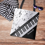 Custom Piano Musiknoten Skriptname Schwarz-weiß<br><div class="desc">Personalisierte moderne, stilvolle Tasche mit Klaviertastatur und Musiknoten in Ihrer Farbauswahl, um den weißen Hintergrund zu ersetzen. Personalisieren Sie Ihre Schriftart mit einem Namen oder Monogramm und/oder einem anderen Text in Ihrem Stil, Ihrer Farbe und Größe. Die Probe wird schwarz und weiß angezeigt. Das Design ist auf beiden Seiten dupliziert....</div>