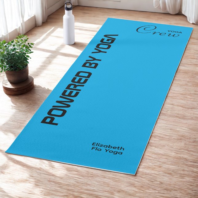 Custom Print Yoga Crew Azure Blue Yogamatte (Blue yoga mat on studio floor.)