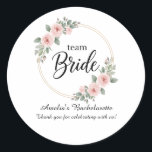 Custom Team Bride Bachelorette Pink Floral Gold Runder Aufkleber<br><div class="desc">Add a touch of floral elegance to your wedding favors! These beautiful round stickers feature the romantic Team Bride design with a gold hoop and pink watercolor roses. Perfect for sealing envelopes, decorating gift boxes, or labeling party favors for your bridal shower and bachelorette party. High-quality and vibrant, they are...</div>