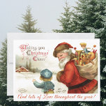 Custom Vintag Santa Claus and Child Christmas Feiertagskarte<br><div class="desc">Verteilen Sie ein paar Weihnachten jubeln Sie diesen Urlaub mit diesem bunten Weihnachtsmann und Kind Vintage Gruß Postkarte. Der Weihnachtsmann hält eine Tüte Spielzeug,  Puppen und Goodies,  während ein Kind in einem blauen Hut ihn im Schnee zu seiner Zuhause führt. Die Nachricht lautet: "Herzlichen Glückwunsch zu Weihnachten".</div>