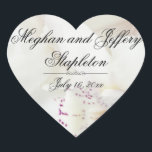 Custom White Floral Heart Shaped Wedding Stickers<br><div class="desc">Eine wunderschöne weiße Orchidee mit lila Akzenten schafft einen atemberaubenden herz=förmigen Hochzeitsaufkleber. Es erzeugt einen strukturierten und interessanten Hintergrund. Die Braut und der Bräutigam Vornamen sind eine der ersten und dann ihr Nachname. Es ist hilfreich für viele Leute zu wissen, ob ihr Nachname jetzt ist. Dann ist ihr Hochzeitstermin unten....</div>