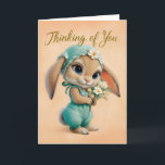 Cute Bunny in Teal Romper & Bonnet Encouragement Karte<br><div class="desc">This heartwarming “Thinking of You” card features an adorable baby bunny in teal overalls and a matching floral bonnet, offering a sweet bouquet of white blossoms. With soft peach tones and a tender expression, this design is perfect for sending comfort, encouragement, or a gentle reminder that someone is holding them...</div>