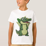 Cute Cartoon Crocodile T-Shirt<br><div class="desc">A cute cartoon crocodile with a big smile and playful personality. This fun reptile illustration features a friendly alligator character surrounded by tropical leaves,  giving it a lively jungle vibe.</div>