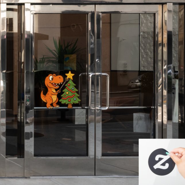 Cute dinosaur with Christmas tree Fensteraufkleber (Büro Tür)