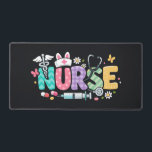 Cute Easter Nurse Medical Humor Schreibtischunterlage<br><div class="desc">Colorful lettering with a nurse hat,  stethoscope,  flowers and playful medical symbols. A cheerful graphic celebrating caring nurses and healthcare professionals during the Easter season with a bright and friendly hospital atmosphere.</div>